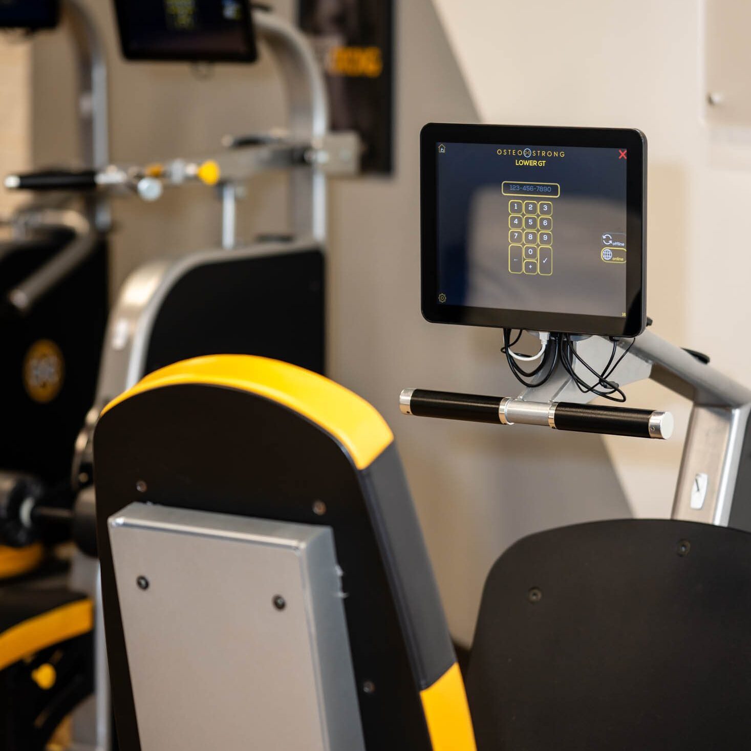 Gym equipment with digital screen display.